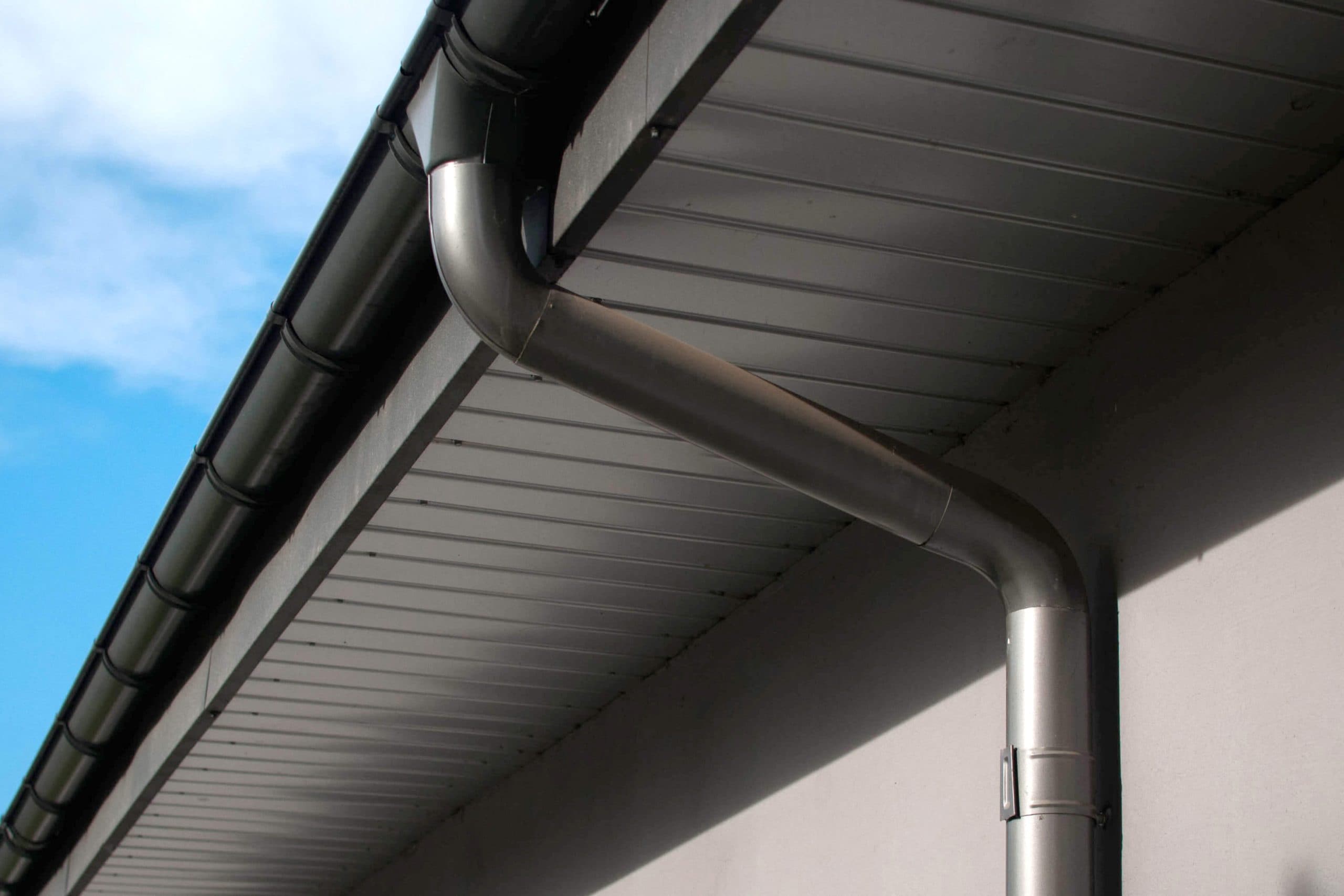 Corrosion-resistant galvanized gutters installed on a commercial building in Roanoke